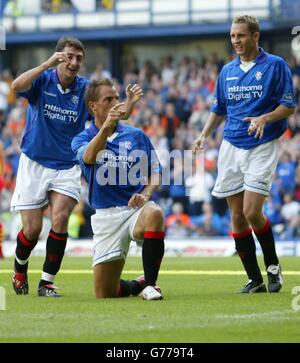 Rangers' Ronald de Boer (centre) celebrates his goal against Partick Thistle during their Bank of Scotland Scottish Premier League match at Rangers' Ibrox Stadium in Glasgow. Stock Photo