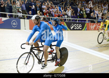 Scotland's Craig Maclean and Neil Fachie celebrate their victory in the Mens Para Sport Sprint Tandem Final at the Sir Chris Hoy Velodrome during the 2014 Commonwealth Games in Glasgow. Stock Photo