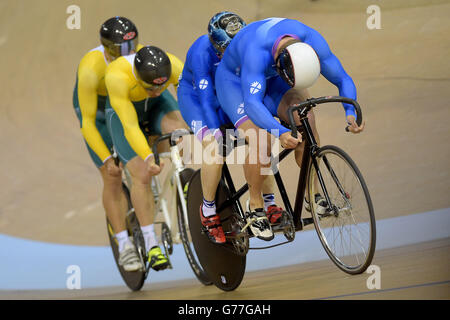 Scotland's Neil Fachie with Craig Maclean beats Australia's Kieran Modra with Jason Niblett to win gold in the Para-Sport Sprint B Tandem during the 2014 Commonwealth Games in Glasgow. Stock Photo