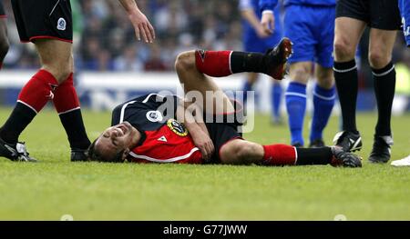 Queens Park Rangers' Matthew Rose goes doewn injured against Oldham during their Nationwide Division Two league semi-final 1st leg match at Boundary Park, Oldham. NO UNOFFICIAL CLUB WEBSITE USE. Stock Photo