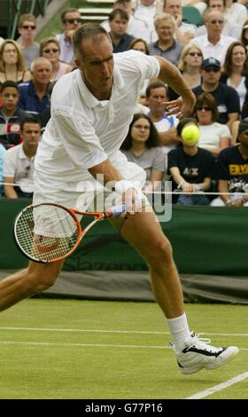 Todd Martin from the USA in action against Rainer Schuettler from Germany at the All England Lawn Tennis Championships in Wimbledon. Stock Photo