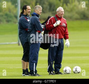 Arsenal's (From L-R) goalkeeper David Seaman (left), manager Arsene Wenger (centre) and goalkeeping coach Bob Wilson (right) during a training session at Arsenal's training ground, London Colney, Hertfordshire. * Arsenal will play Auxerre in their Champions League Group A match tomorrow. Stock Photo