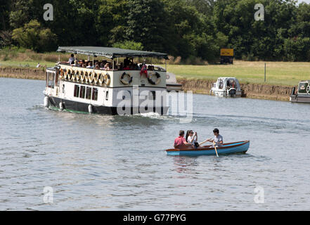 People enjoy the pleasure boats on the river Thames in Windsor, Berkshire.
