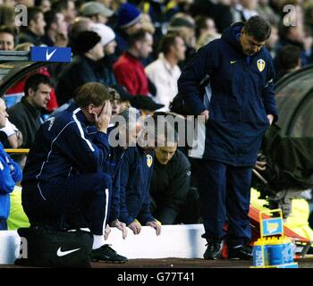 Leeds United manager Terry Venables (centre) looks down in dejection alongside his coaching staff Eddie Gray (second left) and Brian Kidd (right) after their FA Barclaycard Premiership match against Charlton Athletic at Leeds' Elland Road ground. Charlton Athletic defeated Leeds United 2-1. Stock Photo