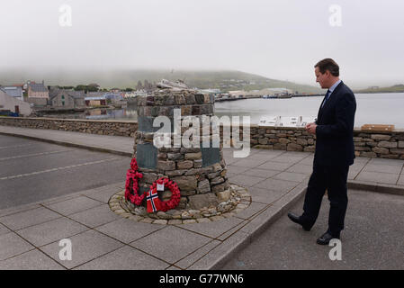 Prime Minister David Cameron lays a wreath at the Shetland Bus memorial in Scalloway today which remembers Norwegian special forces who kept open a link between Shetland and German occupied Norway during the second world war. Stock Photo