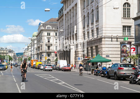 Street scene of Schottengasse with bicyclists and cars in old city centre of Vienna, Austria Stock Photo