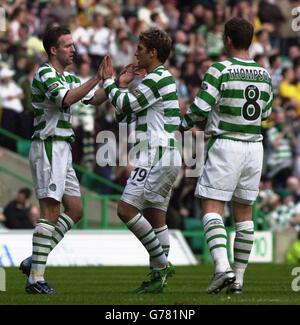 Celtic's Stilian Petrov (centre) celebrates scoring his side's second goal with Paul Lambert and Alan Thompson during their Bank of Scotland Scottish Premiership match at Celtic Park, Glasgow. Stock Photo