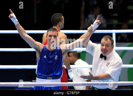 Scotland's Josh Taylor celebrates beating England's Samuel Maxwell in the Men's Boxing Light Welter (64kg) Semi-final 1 at the SECC, during the 2014 Commonwealth Games in Glasgow. Stock Photo