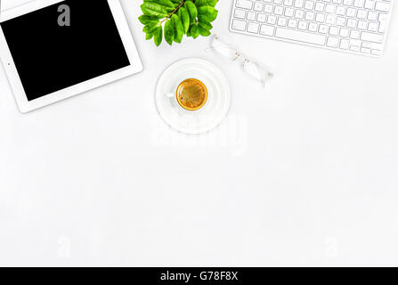 Office desk with coffee, keyboard, tablet pc. Flat lay. Mock up for social media blogger Stock Photo