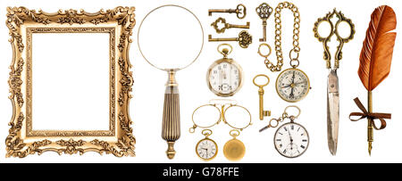 Collection of golden vintage accessories and antique objects. Old keys, picture frame, clock, loupe, compass, ink feather pen, s Stock Photo