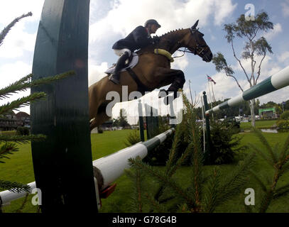 Great Britain's Guy Williams riding Zaire jumps in the Furusiyya FEI Nations Cup of Great Britain presented by Longines during day four of the Longines Royal International Horse Show at Hickstead. Stock Photo