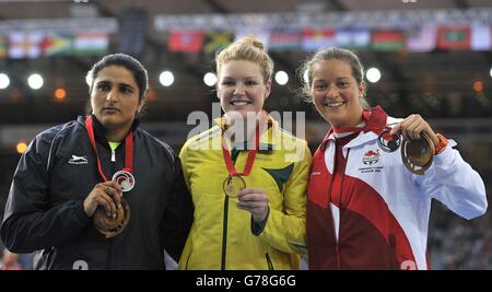 (Left to right) India's Krishna Poonia with her silver medal, Australia's Dani Samuels with her gold medal and England's Jade Lally with her bronze medal for the Women's Discus, at Hampden Park, during the 2014 Commonwealth Games in Glasgow. Stock Photo