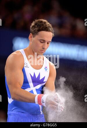 Scotland's Daniel Keatings applies chalk to his hands in the Men's Artistic Gymnastics Horizontal Bar Final at the SSE Hydro, during the 2014 Commonwealth Games in Glasgow.