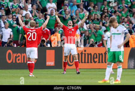 Wales' Gareth Bale (centre) stands hands on hips as England's Chris ...