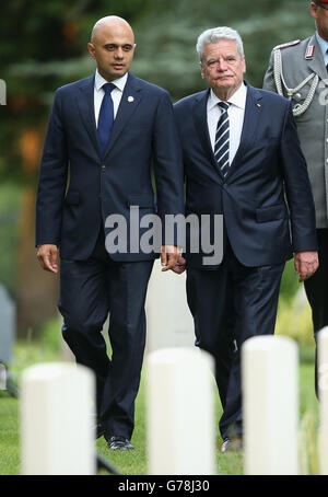 German Prime Minister Joachim Gauck (right) looks at war graves at St Symphorien Military Cemetery as he attends a ceremony to commemorate the 100th anniversary of the outbreak of First World War. Stock Photo