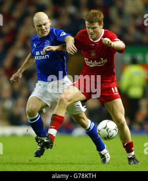 Liverpool's John Arne Riise (right) battles with Everton's Thomas Gravesen during their FA Barclaycard Premiership match at Anfield, Liverpool. Stock Photo