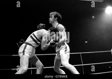 Northern Ireland's P Doherty (left) competes against Scotland's Tom Imrie in the light-middleweight semi-final at the Commonwealth Games. Stock Photo