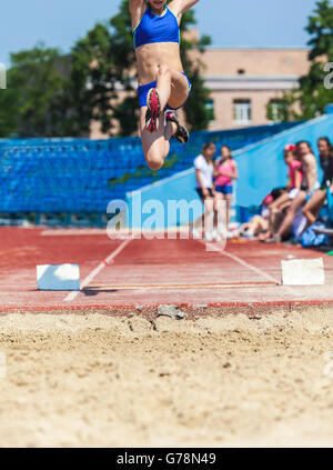 execution of the triple jump, sports background Stock Photo