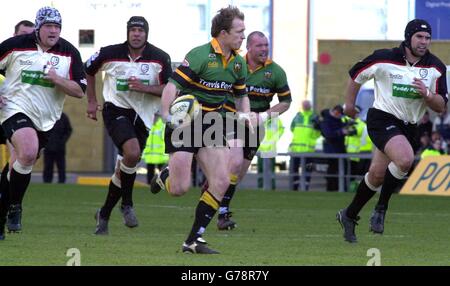 Matt Dawson of Northampton Saints ,who was named as Man of the Match, runs towards the London Irish line in their Powergen Cup semi-final match at the Kassam Stadium at Oxford, which ended 38-9 in Northampton's favour. Stock Photo
