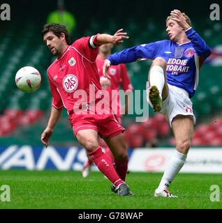 Bristol City's captain Tommy Doherty (left) with Carlisle United's Stuart Green in action during the LDV Vans Trophy final at the Millennium Stadium. NO UNOFFICIAL CLUB WEBSITE USE. Stock Photo