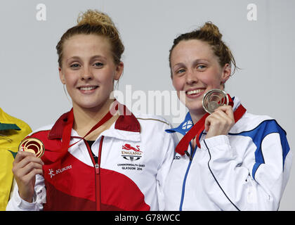 England's Siobhan O'Connor (left) with her gold medal for the Women's 200m Individual Medley Final alongside bronze medalist Scotland's Hannah Miley (right), at Tollcross Swimming Centre, during the 2014 Commonwealth Games in Glasgow. Stock Photo