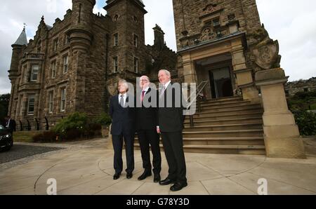 Republic of Ireland Foreign Affairs Minister Charlie Flanagan (centre) with Northern Ireland First Minister Peter Robinson (left) and Deputy First Minister Martin McGuinness at Stormont Castle. Stock Photo