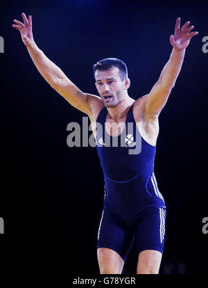 Scotland's Viorel Etko celebrates winning the FS 61 kg wrestling bronze medal match at the SECC, during the 2014 Commonwealth Games in Glasgow at the SECC, during the 2014 Commonwealth Games in Glasgow. Stock Photo
