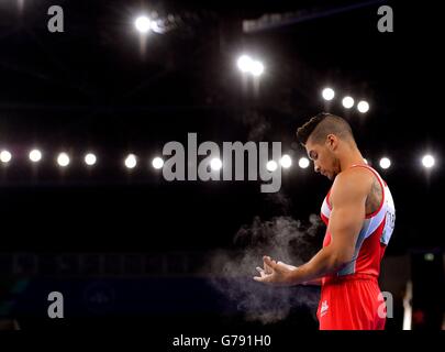 England's Louis Smith dusts chalk from his hands during the Men's Artistic Gymnastics Pommel Horse Final at the SSE Hydro, during the 2014 Commonwealth Games in Glasgow.
