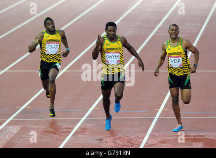 Jamaica's Rasheed Dwyer (centre) wins ahead of second placed Warren Weir (right) and third placed Jason Livermore (left) in the Men's 200m Final at Hampden Park, during the 2014 Commonwealth Games in Glasgow. Stock Photo