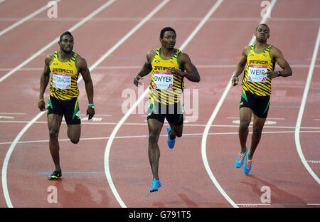 Jamaica's Rasheed Dwyer (centre) wins ahead of second placed Warren Weir (right) and third placed Jason Livermore (left) in the Men's 200m Final at Hampden Park, during the 2014 Commonwealth Games in Glasgow. Stock Photo