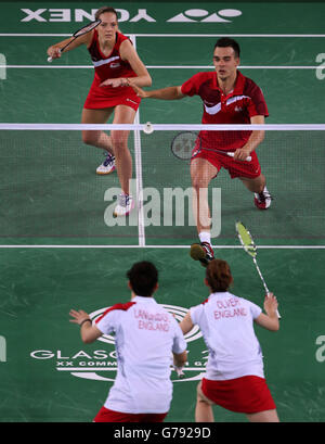 England's Chris Adcock and Gabrielle Adcock (top) in the Mix Doubles Gold medal match against England's Heather Oliver and Chris Langridge at the Emirates Arena, during the 2014 Commonwealth Games in Glasgow. Stock Photo