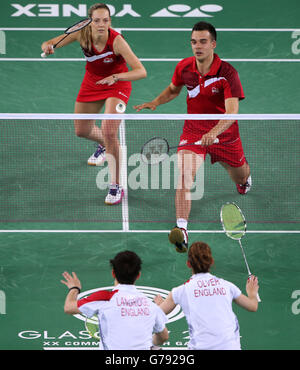 England's Chris Adcock and Gabrielle Adcock(top) in the Mix Doubles Gold medal match against England's Heather Oliver and Chris Langridge at the Emirates Arena, during the 2014 Commonwealth Games in Glasgow. Stock Photo