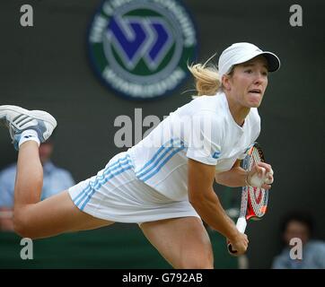 Justine Henin-Hardenne of Belgium seen with trophy after defeating Maria  Sharpova of Russia 7-5, 6-2 in the finals of the Dubai Tennis Championships  in Dubai, United Arab Emirates on February 25, 2006.