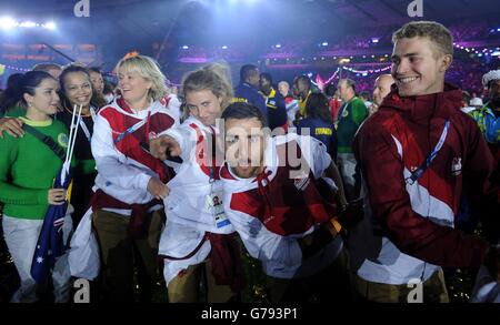 Team England athletes dance to the Locomotion during the 2014 Commonwealth Games Closing Ceremony at Hampden Park, Glasgow. Stock Photo