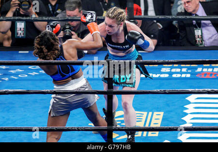 Brooklyn, New York, USA. 25th June, 2016. HEATHER HARDY (black and blue trunks) and KIRSTIE SIMMONS battle in a featherweight bout at the Barclays Center in Brooklyn, New York. © Joel Plummer/ZUMA Wire/Alamy Live News Stock Photo