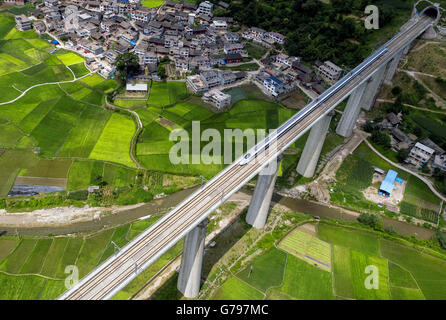 Beijing, China. 22nd June, 2016. Aerial photo taken on June 22, 2016 shows a bullet train running on the Kaili section of Shanghai-Kunming high-speed railway in southwest China's Guizhou Province. © Wu Jibin/Xinhua/Alamy Live News Stock Photo