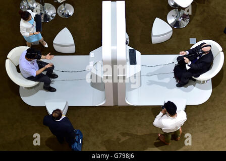 Tianjin, China. 26th June, 2016. Visitors try leap motion controllers at the exploration zone on the Annual Meeting of the New Champions 2016, or the Summer Davos Forum, in Tianjin, north China, June 26, 2016. © Yue Yuewei/Xinhua/Alamy Live News Stock Photo