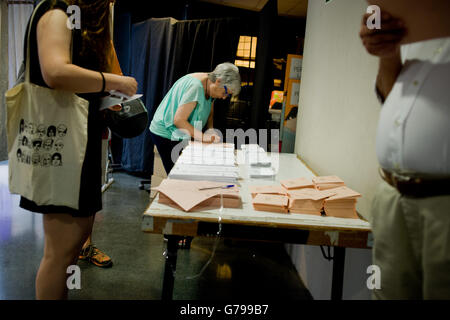 June 26, 2016 - Barcelona, Catalonia, Spain - A woman looks at ballots in a polling station in Barcelona, Spain. Spaniards are voting its second general election after six months of caretaker government. (Credit Image: © Jordi Boixareu via ZUMA Wire) Stock Photo