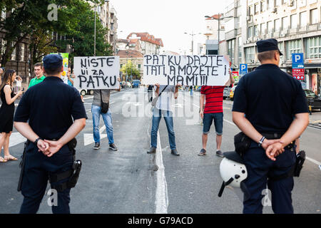 Belgrade, Serbia. 25th June, 2016. Anti demonstrators with banners at demnstrations in Belgrade. It captioned 'Give the duck to your dad, ant to your mom also'. Milos Bojovic/Alamy Live News Stock Photo