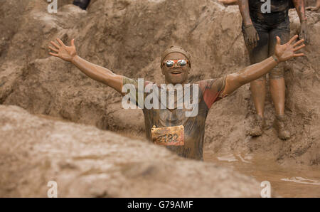 Mud glorious mud on the Mud Mile obstacle at Tough Mudder at Drumlanrig Castle, Dumfries and Galloway, Scotland, UK. Stock Photo