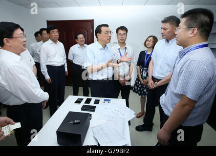 Tianjin, China. 26th June, 2016. Chinese Premier Li Keqiang visits Tianjin Optical Electrical Group Co., Ltd. during an inspection tour in Tianjin, north China, June 26, 2016. © Pang Xinglei/Xinhua/Alamy Live News Stock Photo