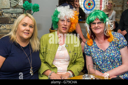 Skibbereen, West Cork, Ireland. 26th June, 2016. Ireland fans Sylvia Nallen, Ellen Crowley amd Patricia Crowley, all from Skibbereen, were wearing strange headpieces before watching the Ireland Vs France game in the Eldon Hotel in Skibbereen in the 2016 Euros. Credit: Andy Gibson/Alamy Live News. Stock Photo