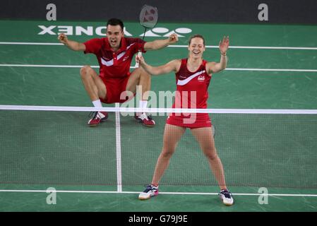 England's Chris Adcock and Gabrielle Adcock celebrate their win in the Mix Doubles Gold medal match against England's Heather Oliver and Chris Langridge at the Emirates Arena, during the 2014 Commonwealth Games in Glasgow. Stock Photo