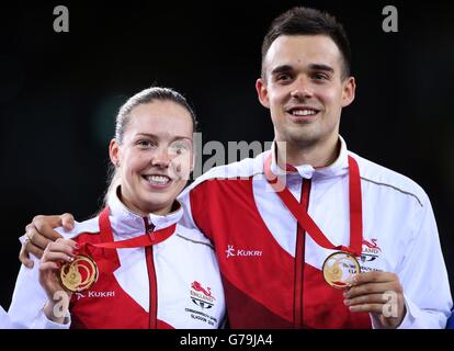 England's Chris Adcock and Gabrielle Adcock with their gold medals after their win in the Mix Doubles Gold medal match against England's Heather Oliver and Chris Langridge at the Emirates Arena, during the 2014 Commonwealth Games in Glasgow. Stock Photo