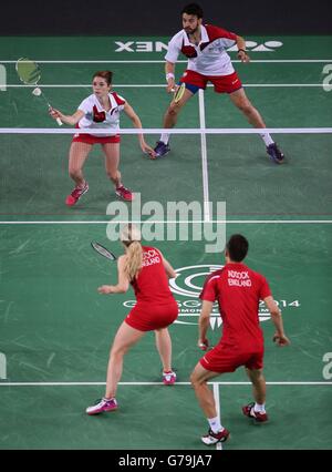 England's Chris Adcock and Gabrielle Adcock in the Mix Doubles Gold medal match against England's Heather Oliver and Chris Langridge(top) at the Emirates Arena, during the 2014 Commonwealth Games in Glasgow. Stock Photo