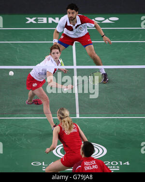 England's Chris Adcock and Gabrielle Adcock in the Mix Doubles Gold medal match against England's Heather Oliver and Chris Langridge(top) at the Emirates Arena, during the 2014 Commonwealth Games in Glasgow. Stock Photo