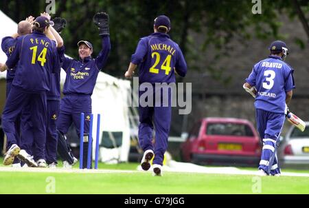 Scottish Saltire batsman Rahul Dravid (far right) walks towards the boundary after being bowled out by Durham's Neil Killeen, during their Division Two National Cricket League clash in Edinburgh. Stock Photo