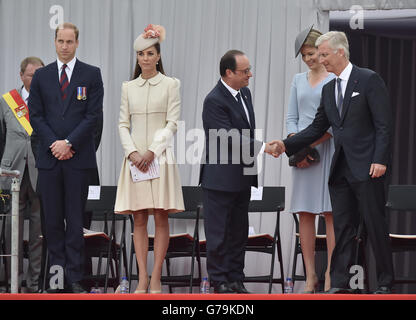 ois Hollande (third right) shakes hands with Belgian King Philippe and Queen Mathilde of Belgium as the Duke and Duchess of Cambridge look on during ceremony at the Cointe Inter-allied Memorial, Liege, Belgium, commemorating the 100th anniversary of the start of the First World War. Stock Photo