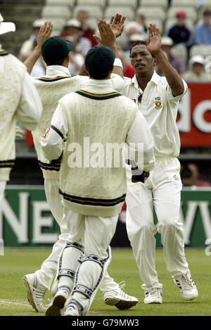 South Africa's Makhaya Ntini celebrates after he clean bowls England opening batsman Marcus Trescothink for 31, during the fouth day's play of nPower test England against South Africa in Edgbaston, Birmingham. Stock Photo