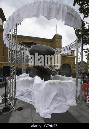 A three-metre high bronze sculpture called 'Large Spindle Piece' by Henry Moore being unveiled in King's Cross Square outside King's Cross station in London. Stock Photo